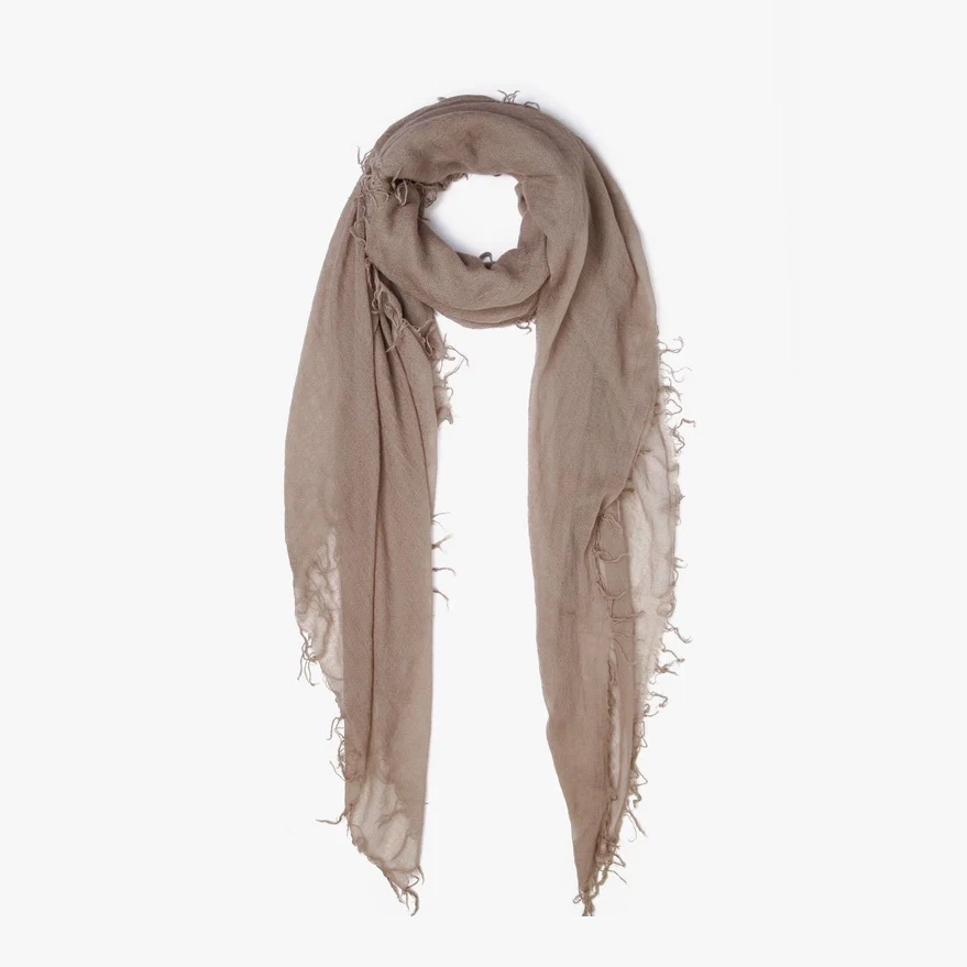 Lightweight travel scarf styled with outfit, adding color and versatility while packing light